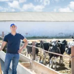 farmer-is-working-farm-with-dairy-cows